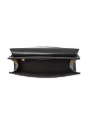 Czarna elegancka listonoszka damska TOREC-1165-99(W26) - widok produktu z góry, na białym tle.